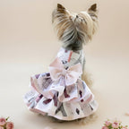 Mona & Milo The Petit Paris Dress, stylish children's dress with floral pattern and ruffled sleeves, displayed on a hanger.