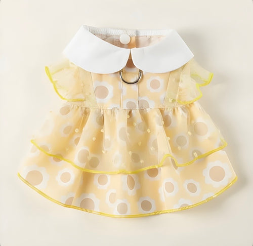 Yellow pet dress with white polka dots and a white collar on a beige background