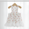 Mona & Milo Lola Cotton Floral Dress featuring a lightweight fabric with a vibrant floral pattern and sleeveless design.