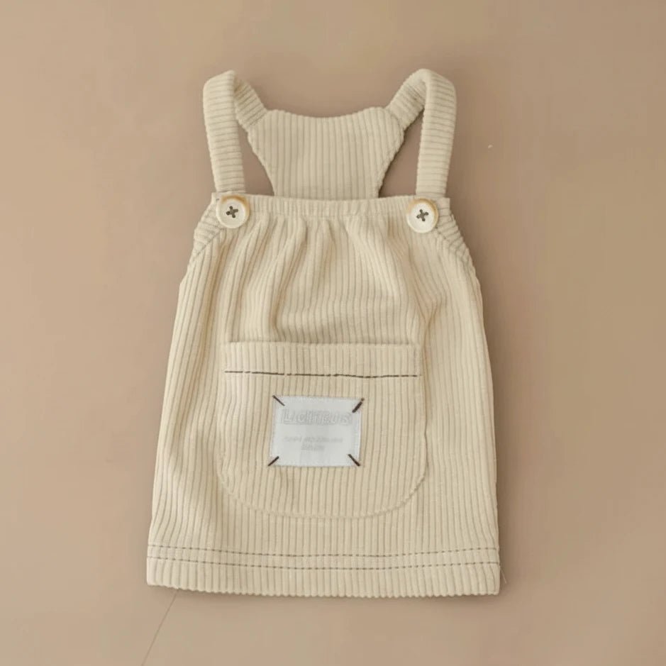 Butterscotch corduroy pinafore dress by Mona & Milo, featuring a classic sleeveless design