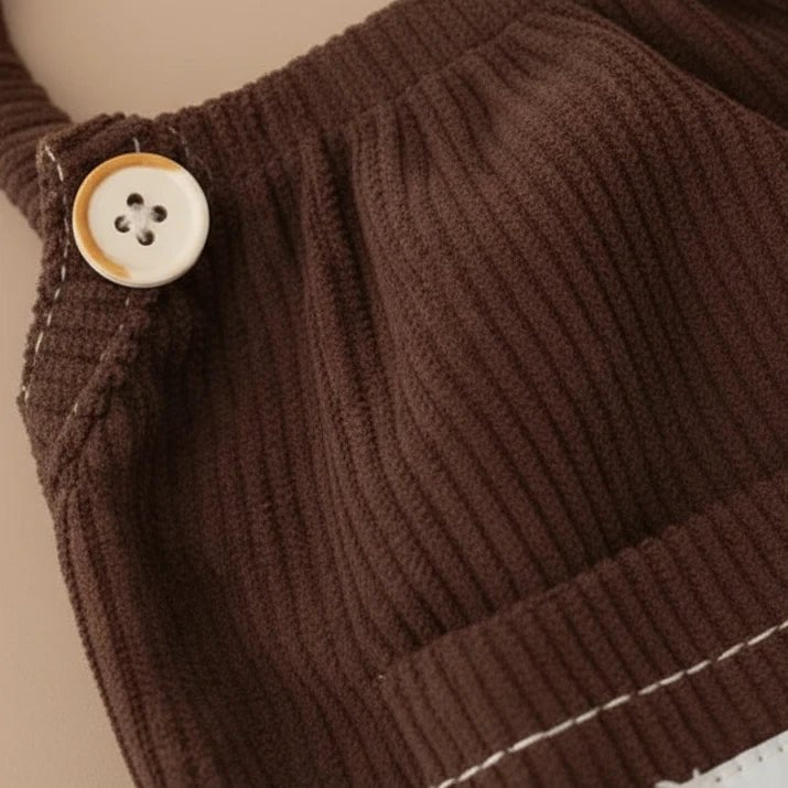 Butterscotch corduroy pinafore dress by Mona & Milo, featuring a classic sleeveless design and front pocket detail.