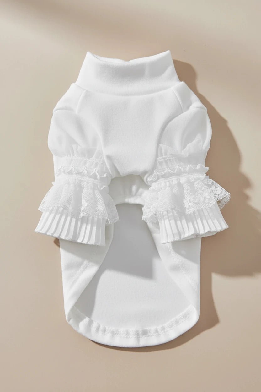 Mona & Milo Moonlace turtleneck top in black, close-up of soft, fitted fabric with moonlace detailing at the neckline.