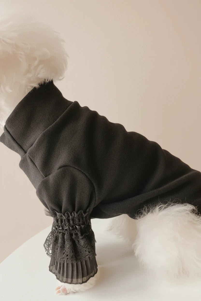 Mona & Milo Moonlace turtleneck top in soft fabric, featuring a high collar and moonlace detailing, worn by a model.