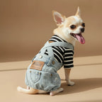 Mona & Milo Hugo denim jumpsuit overalls with adjustable straps and front pockets, displayed on a hanger.