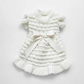 Noelle Bow Knit Dress by Mona & Milo, featuring a stylish knitted dress with bow detail