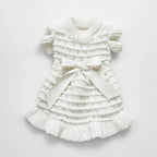Noelle Bow Knit Dress by Mona & Milo, featuring a stylish knitted dress with bow detail