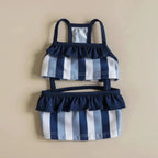 Mona & Milo Nautique striped swimsuit for women, featuring a stylish blue and white pattern