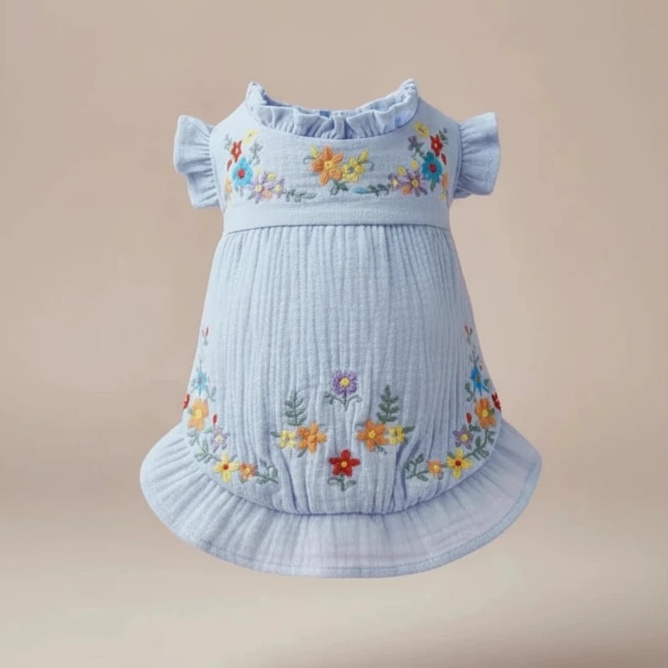 Mona & Milo Soleil floral embroidered dress featuring vibrant floral patterns and delicate embroidery on lightweight fabric.