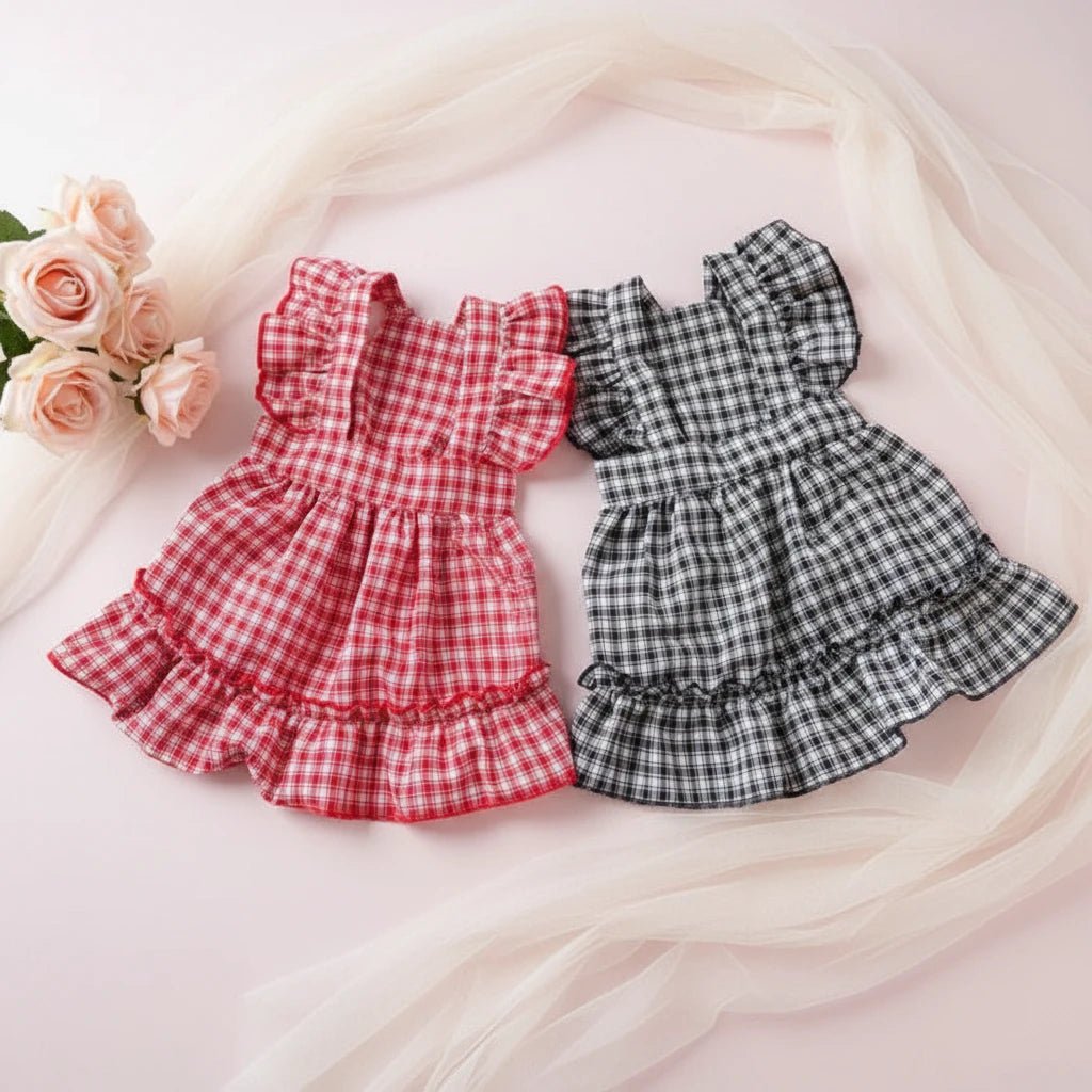 Two checkered dog dresses, one red and one black and white- Mona & Milo
