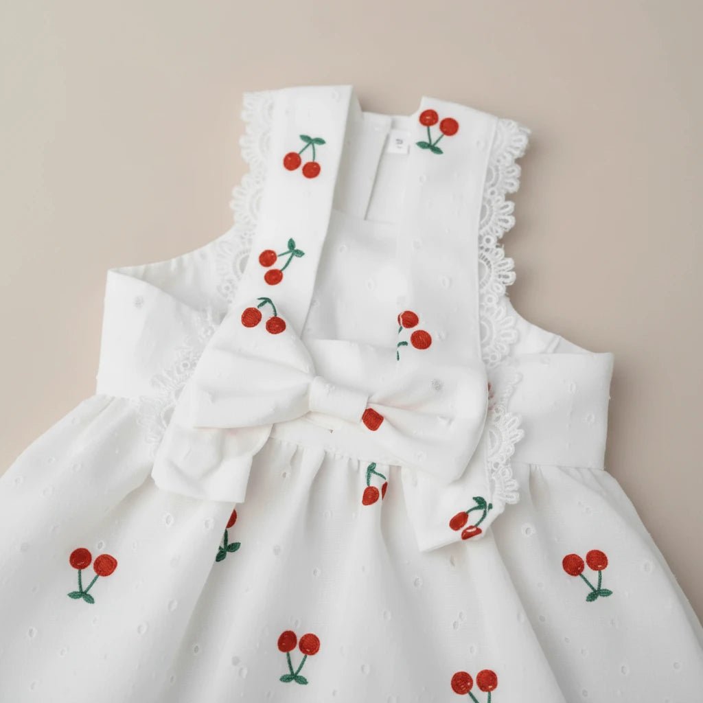 Cherry print cotton dress by Mona & Milo featuring a playful confetti pattern and a comfortable, stylish fit.